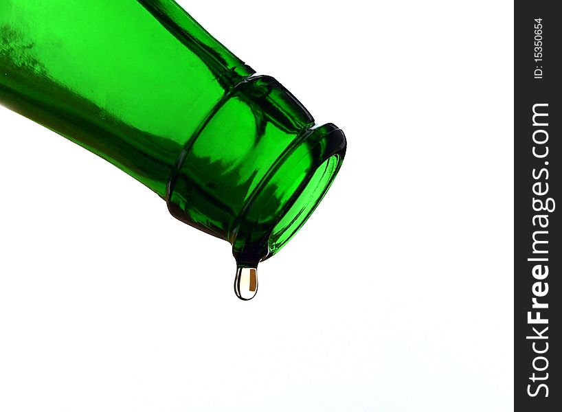 Green bottle with the last drop of beer