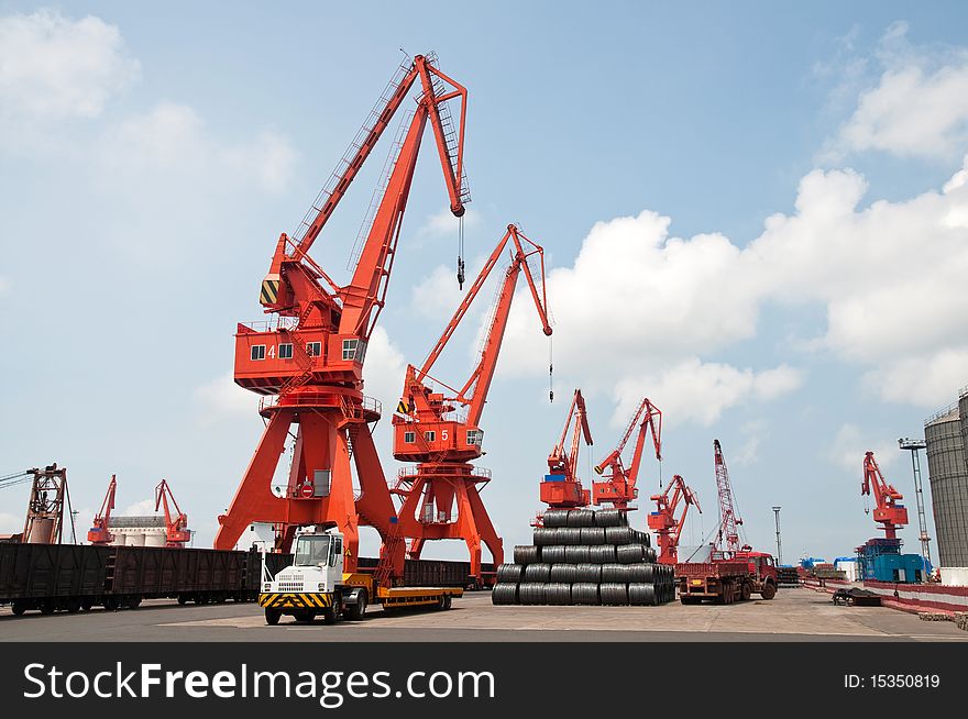 Mang cranes against blue sky，which taken in Qingdao Port China. Mang cranes against blue sky，which taken in Qingdao Port China