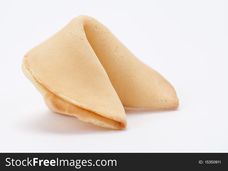 Big fortune cookie close-up, isolated on a white background. Big fortune cookie close-up, isolated on a white background