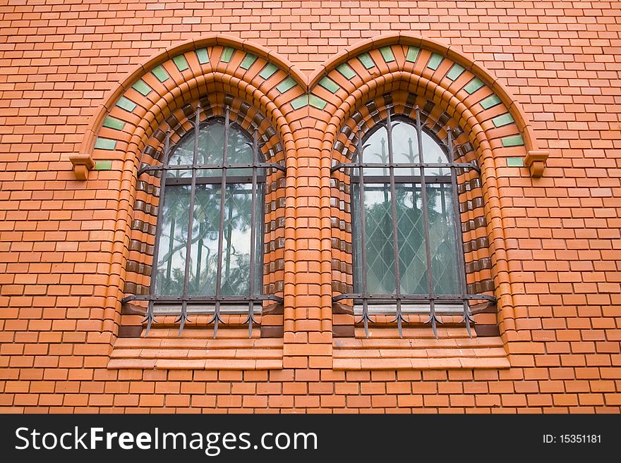 Red Bricks Church, brick wall, design windows, old building in Czech Republic, Breclav. Red Bricks Church, brick wall, design windows, old building in Czech Republic, Breclav