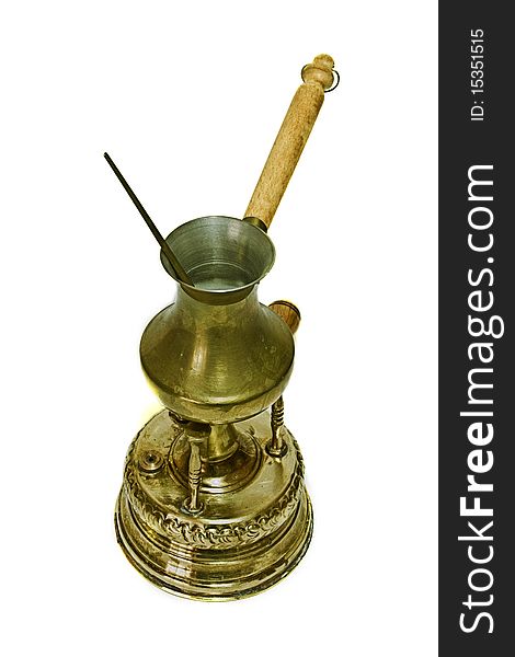 Antique Turkish Bras Alcohol Burner, with a coffee put on top, isolated on a white background. Antique Turkish Bras Alcohol Burner, with a coffee put on top, isolated on a white background