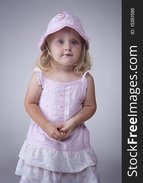 Cute portrait of little girl in pink dress. Cute portrait of little girl in pink dress