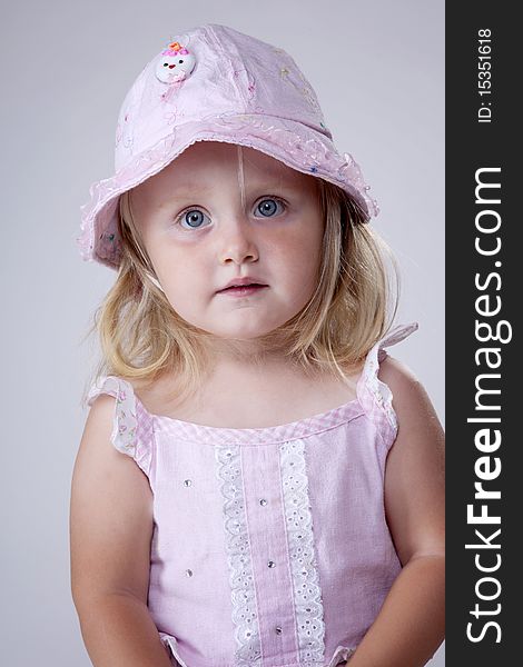 Innocent looking little girl portrait with cute hat. Innocent looking little girl portrait with cute hat