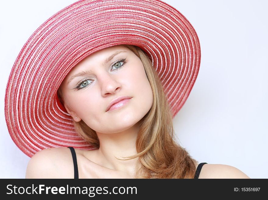 Portrait pretty woman in panama on blue background