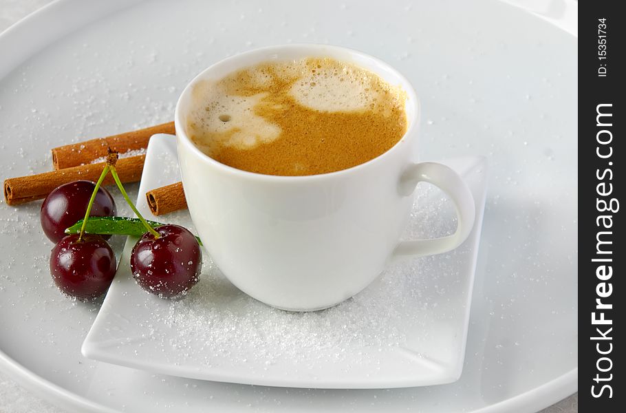 Coffee cup ,cinnamon and cherries. Coffee cup ,cinnamon and cherries