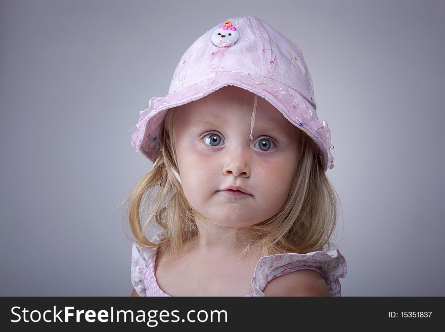 Beautiful small girl with cute hat portrait. Beautiful small girl with cute hat portrait