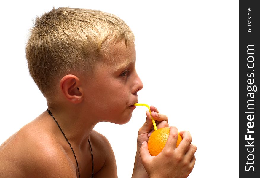Boy drinking orange juice through straws isolated on a white background. Boy drinking orange juice through straws isolated on a white background.