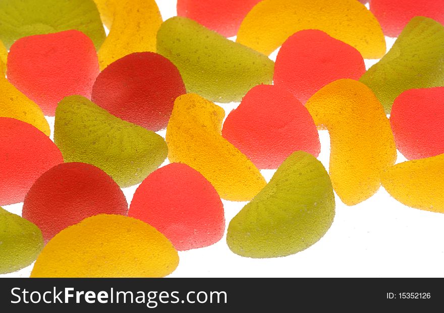 Coloured fruit candies on a white background.