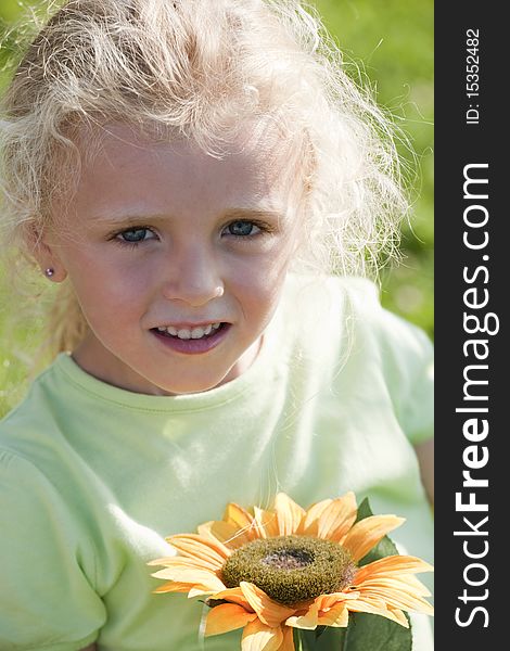 Cute little girl with sunflower