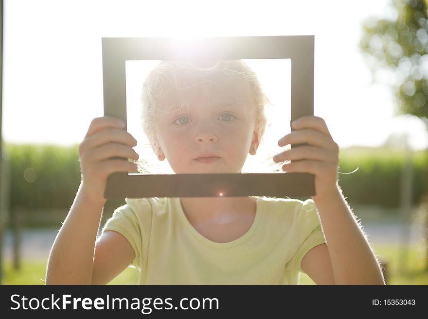Little beautiful girl in frame. Little beautiful girl in frame