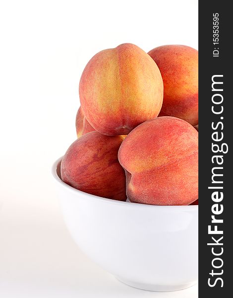 Bowl of ripe juicy summer picked peaches