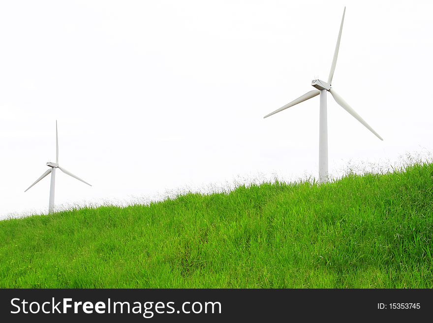 Windmills in a green meadow