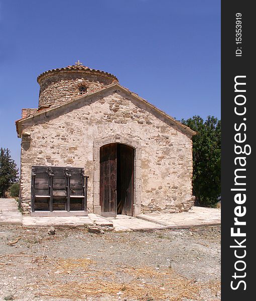 Old small stone church on a hill overlooking protaras on the island of Cyprus under blue sky. Old small stone church on a hill overlooking protaras on the island of Cyprus under blue sky