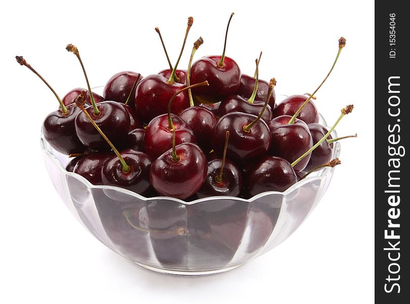 A bowl of  cherrys on white background