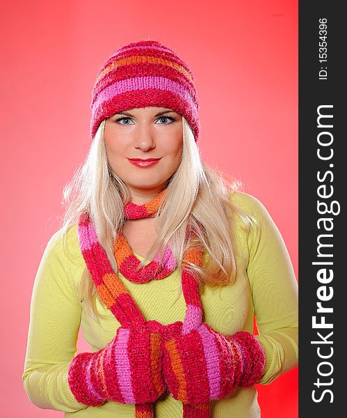 Pretty funny winter woman in hat and gloves