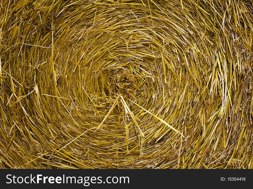 Closeup of a circular straw bale for background usage