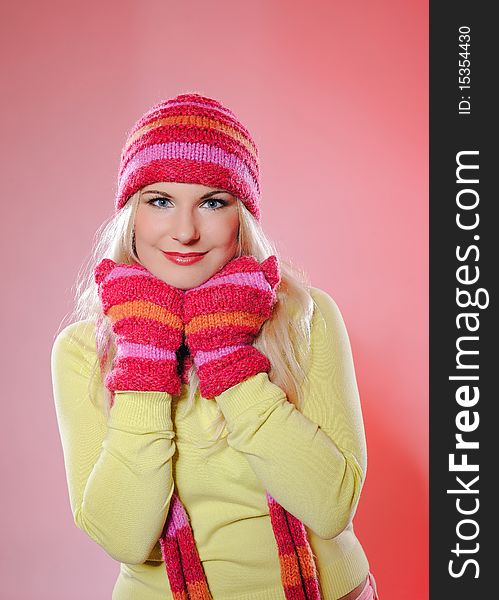 Seasonal portrait of pretty funny woman in hat and gloves smiling. white background. Seasonal portrait of pretty funny woman in hat and gloves smiling. white background