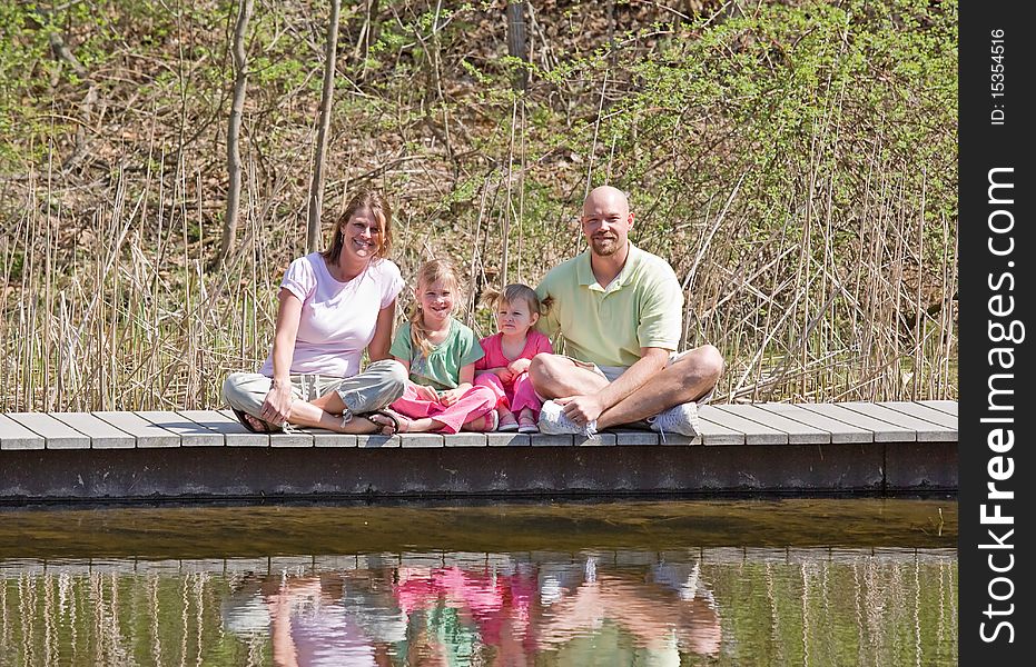Family of Four Having Fun at the Lake. Family of Four Having Fun at the Lake