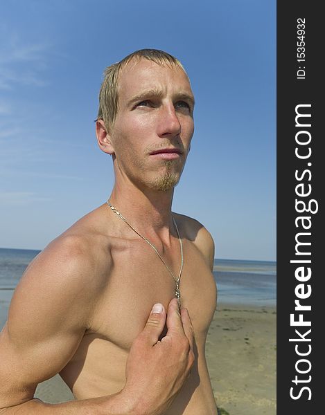 Young man with cross on the chest. Young man with cross on the chest.