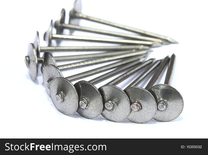 Large number of nails on a white background. Large number of nails on a white background