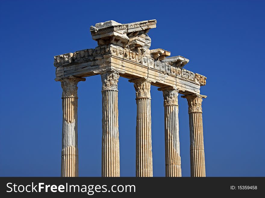 Apollo temple ruins in Side Turkey on a deep blue sky background. Apollo temple ruins in Side Turkey on a deep blue sky background