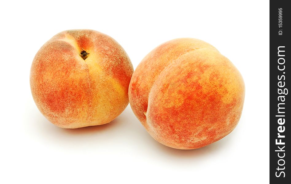 Fresh peaches isolated on white