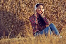 Girl With A Beautiful Smile Enjoying Music. Stock Photography