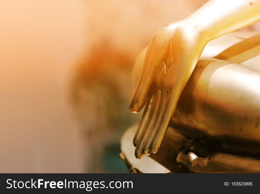 Golden Buddha hand in the temple