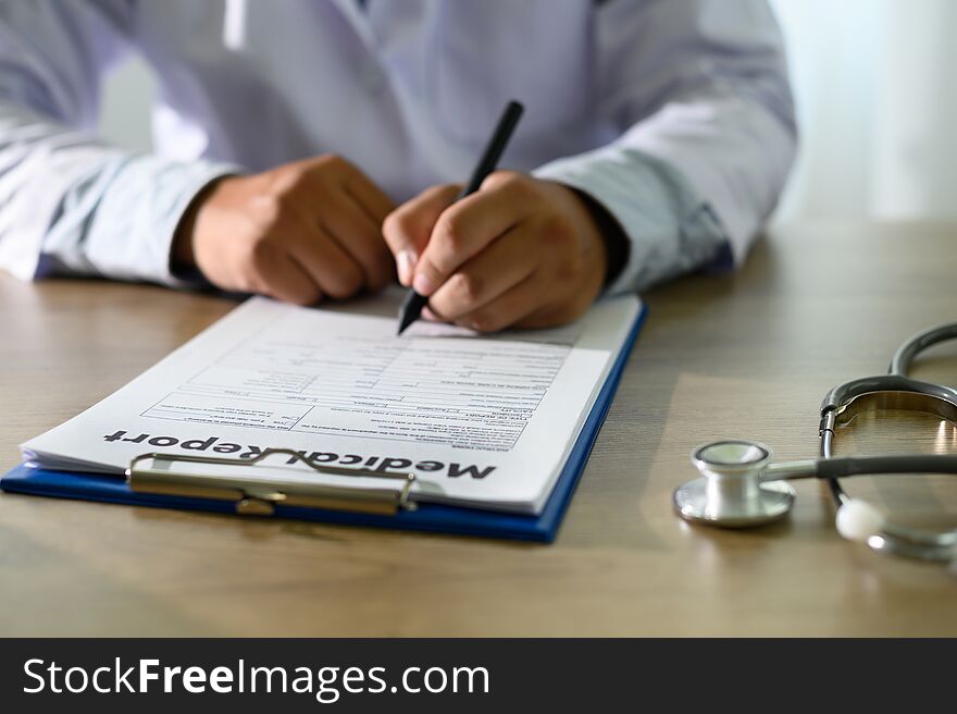 Doctor using computer medical record  medical report or medical certificate database of patient`s health care