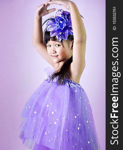 Portrait of asian little  girl in purple dress