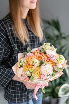 Beautiful Bouquet Of Mixed Flowers In Woman Hand. Floral Shop Concept . Handsome Fresh Bouquet. Flowers Delivery. Stock Photos