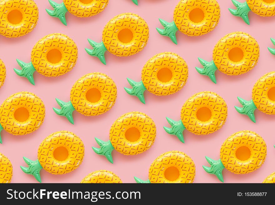 Seamless pattern with Inflatable penapples on a pink background. Summer concept