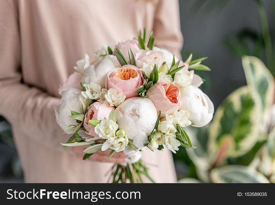 Bridal bouquet with white. Beautiful bouquet of mixed flowers in woman hand. Floral shop concept . Handsome fresh