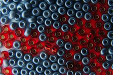 Close-up Of Red And Silver Colored Glass Beads Stock Images