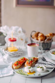 Norway Breakfast. Toasts With Salmon, Boiled Eggs On White Wooden Table With Salad, Coffee, Orange Juice And Croissants Stock Photos Norway Breakfast. Toasts With Salmon, Boiled Eggs On White Wooden Table With Salad, Coffee, Orange Juice And Croissants Stock Photos