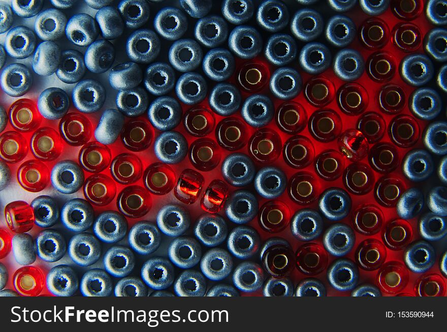 Close-up of red and silver colored glass beads