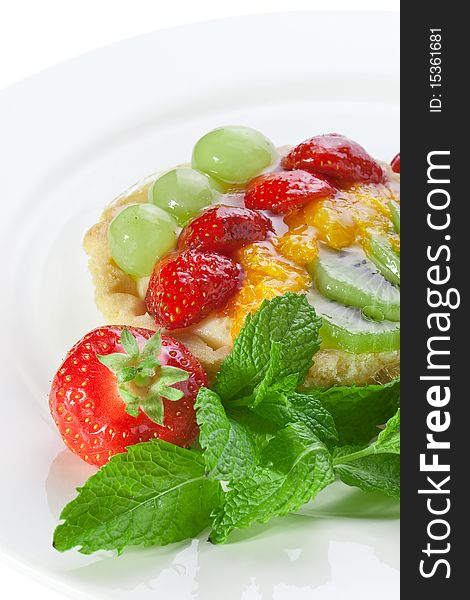 Fruit tart and fruits on a plate