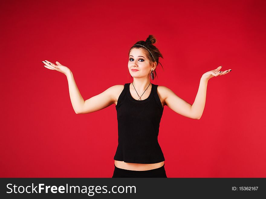 Picture of a adorable alluring girl in black on red background