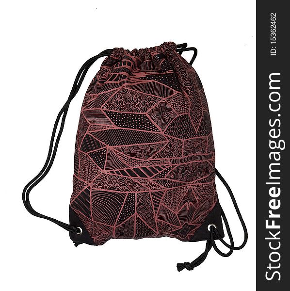 Studio-shot of a red patterned shoulderbag. The photo is isolated in front of a white background. Studio-shot of a red patterned shoulderbag. The photo is isolated in front of a white background.