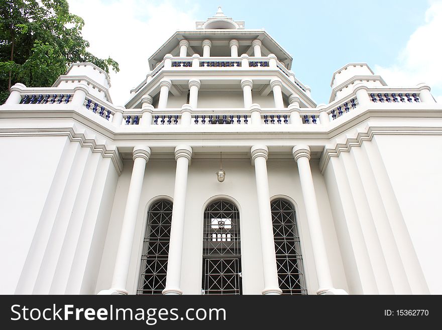 White huge classic facade with blue sky