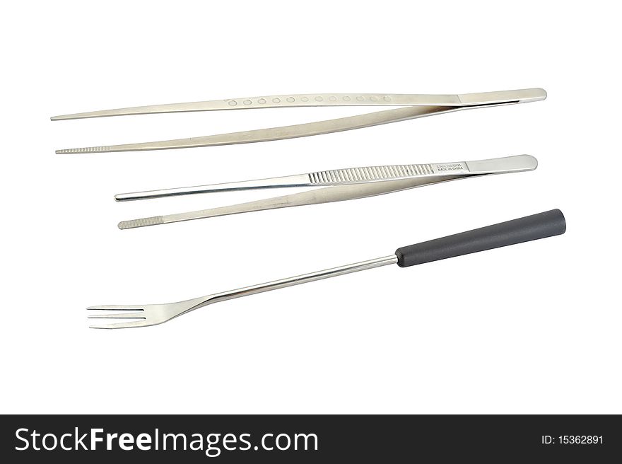 Tweezers and fork isolated on white