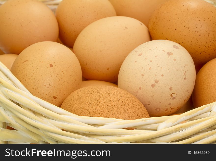 Brown Eggs in wooden basket. Brown Eggs in wooden basket