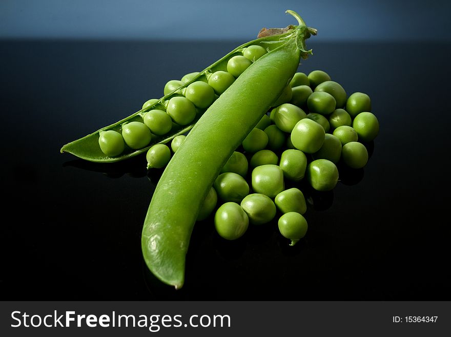 Green  gardean peas on black background. Green  gardean peas on black background