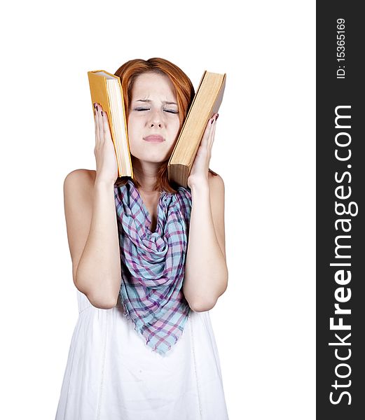 Young student with two book and headache. Studio shot.