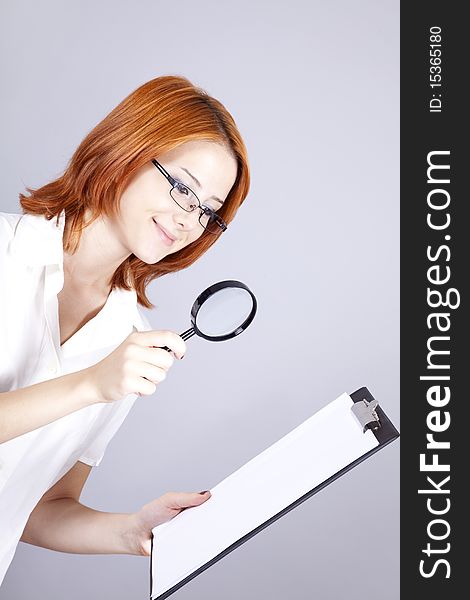 Businesswomen With White Plan Board And Loupe