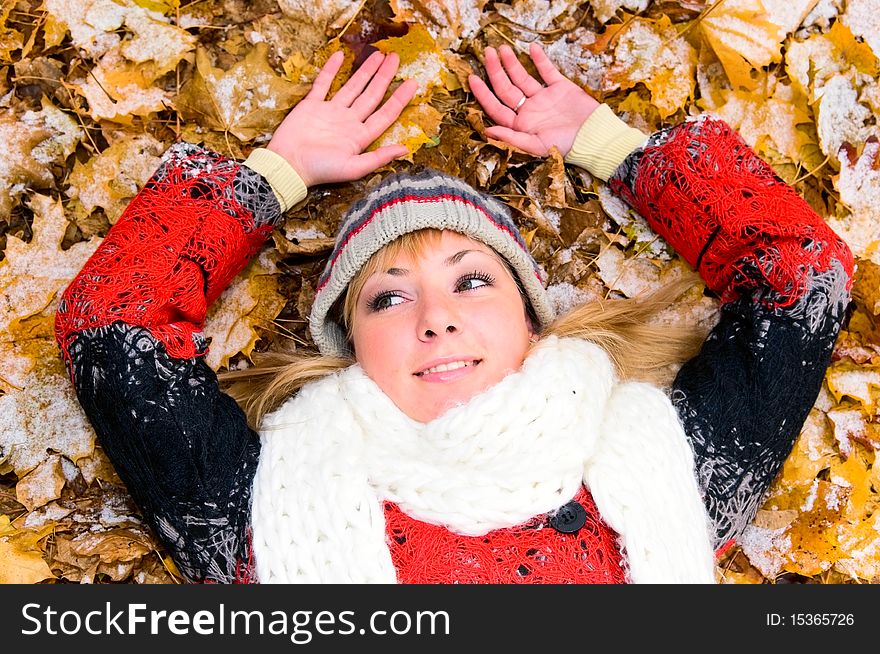 Young smiling woman resting on the ground. Young smiling woman resting on the ground