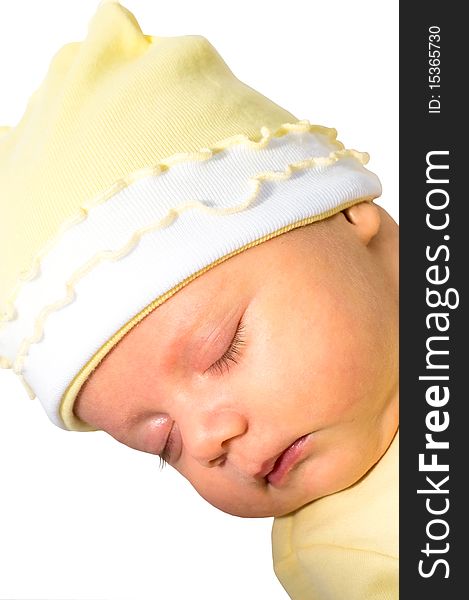 Close-up image of sleeping infant in yellow hat. Close-up image of sleeping infant in yellow hat