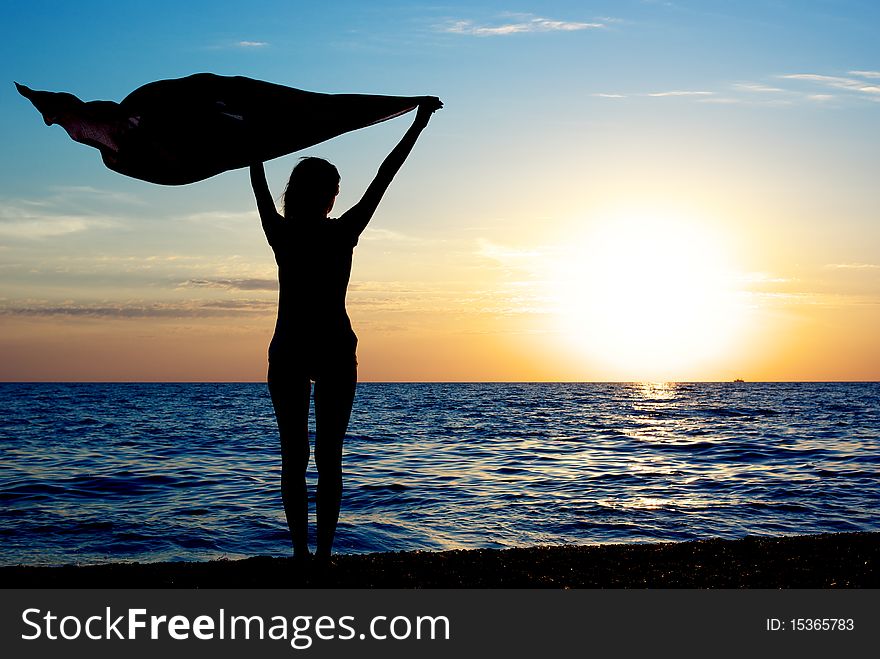 Girl with kerchief on the sunset