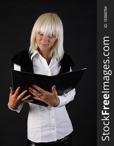 Beautiful business blonde lady looks at you with folder