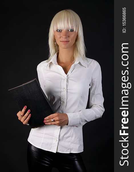 Beautiful business blonde lady looks at you with folder